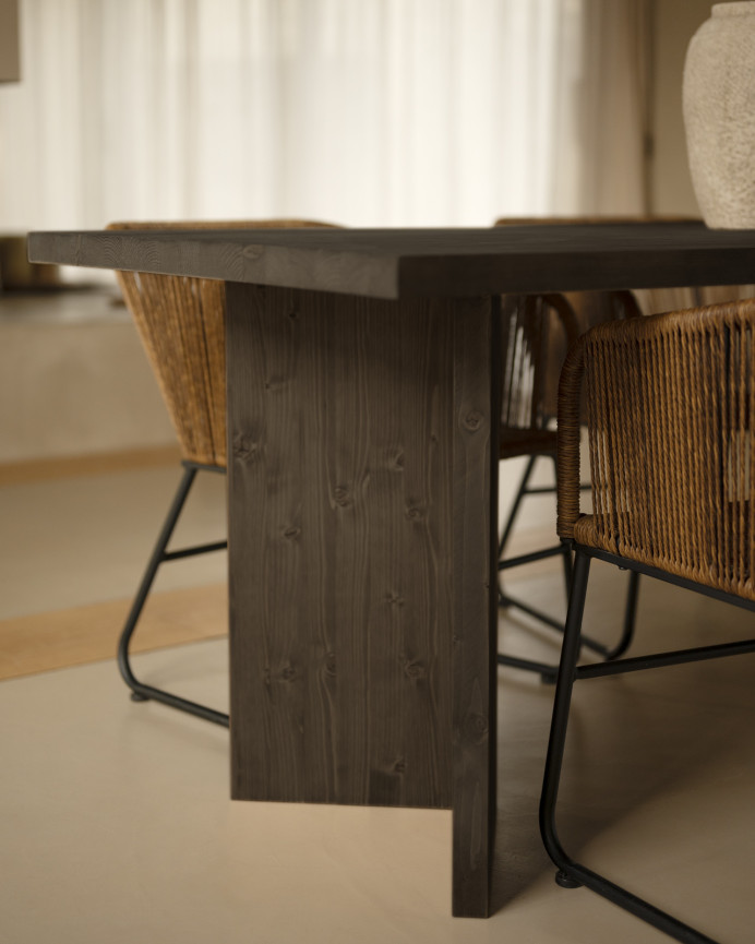 Solid wood dining table in black tone available in various sizes.