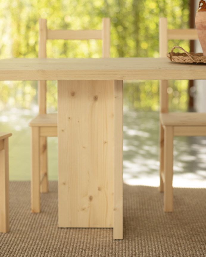 Solid wood dining table in a natural tone available in various sizes