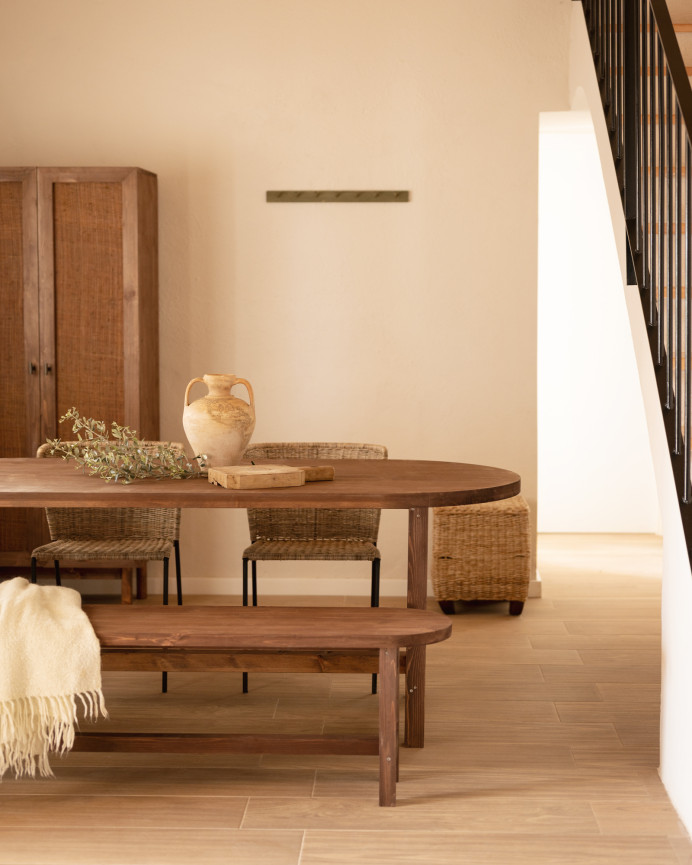 Oval solid wood dining table in walnut tone available in various sizes.