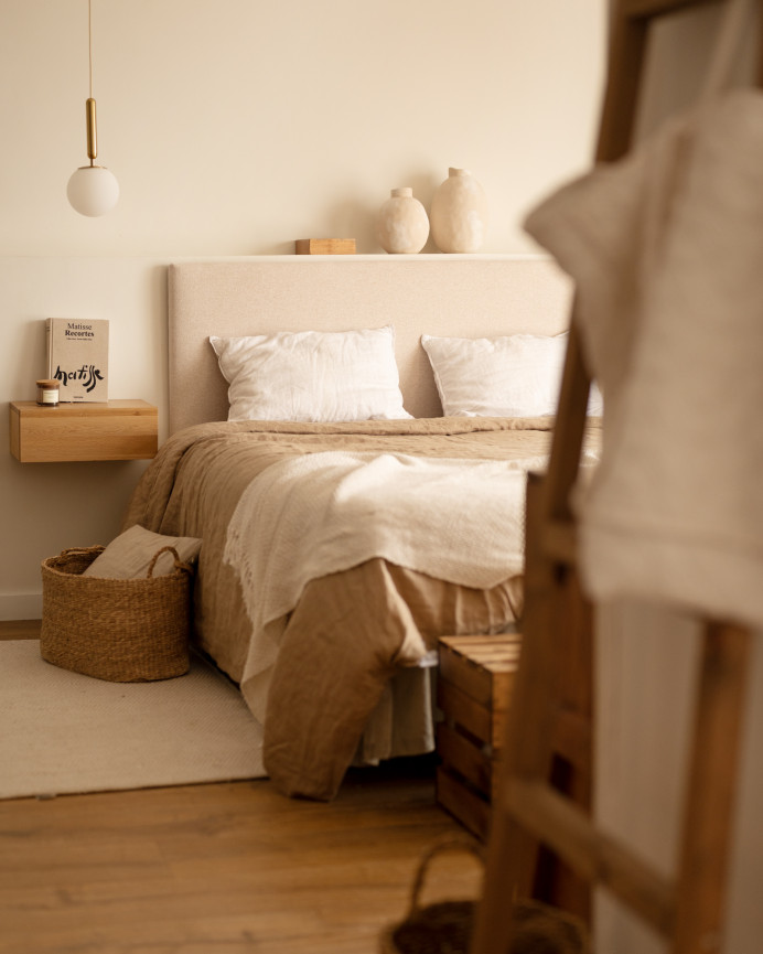 Upholstered beige headboard set and 2 dark oak solid wood floating nightstands in various sizes.