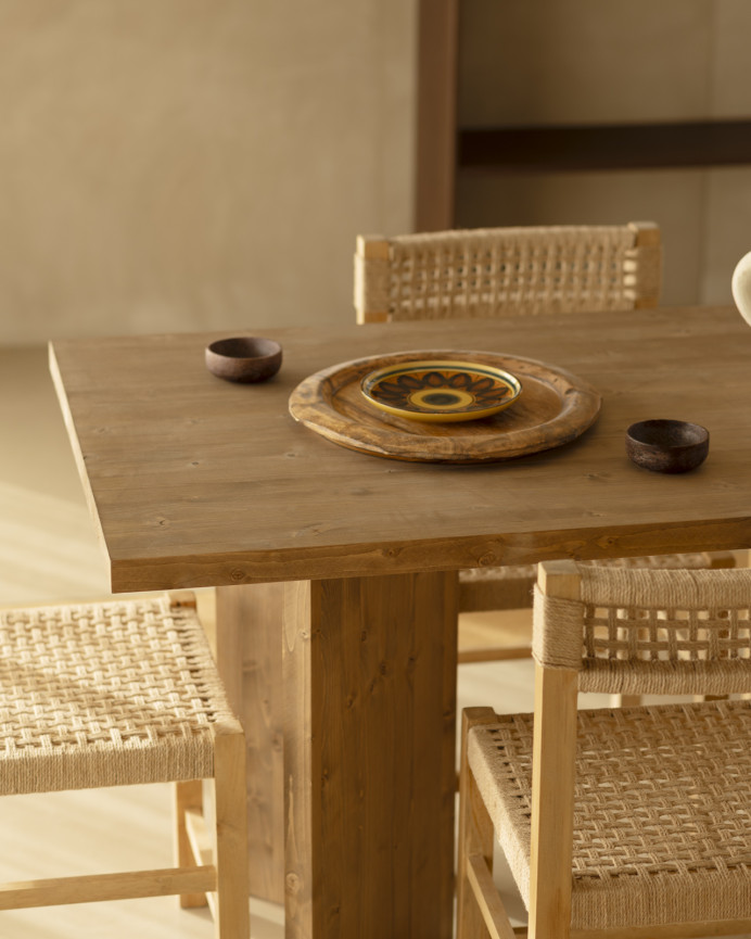 Solid wood dining table in dark oak tone available in various sizes.