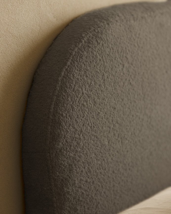 Removable dark gray bouclé upholstered headboard available in various sizes.
