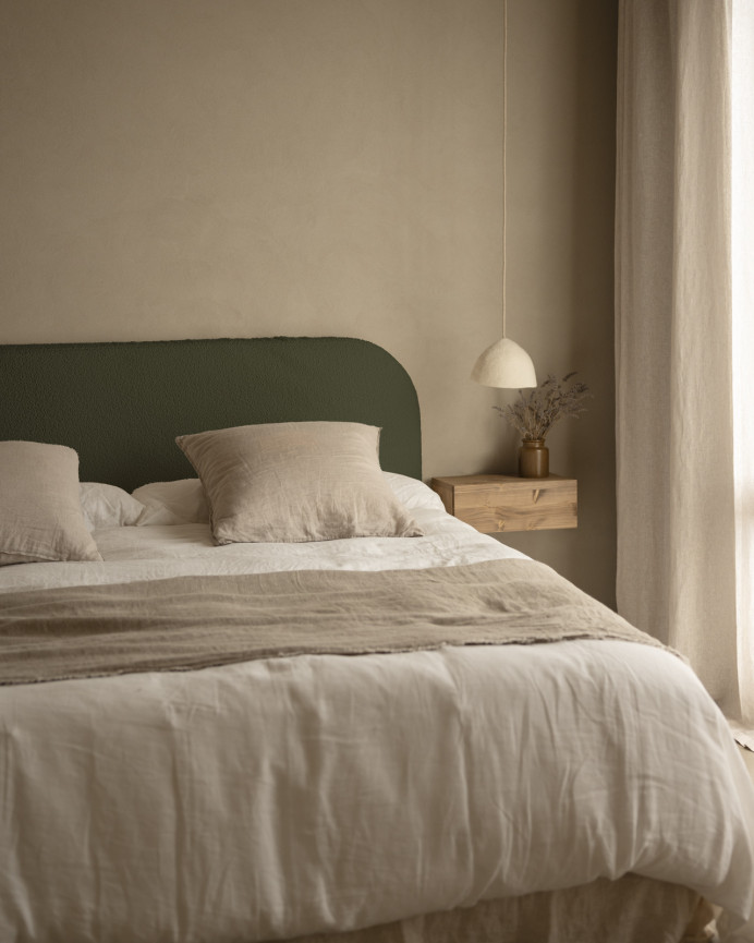 Upholstered headboard with removable cover in green bouclé fabric in various sizes.