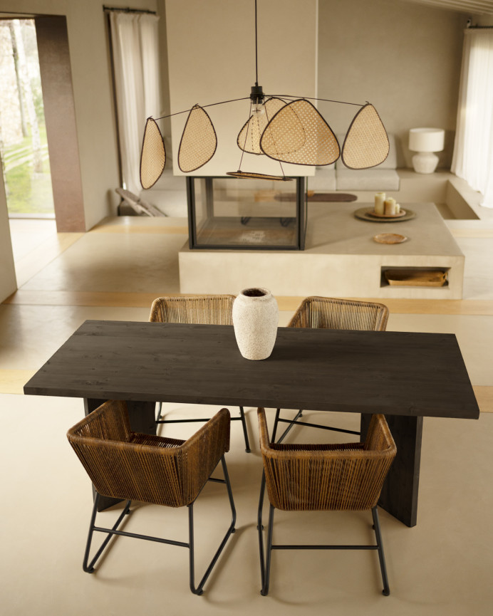 Solid wood dining table in black tone available in various sizes.
