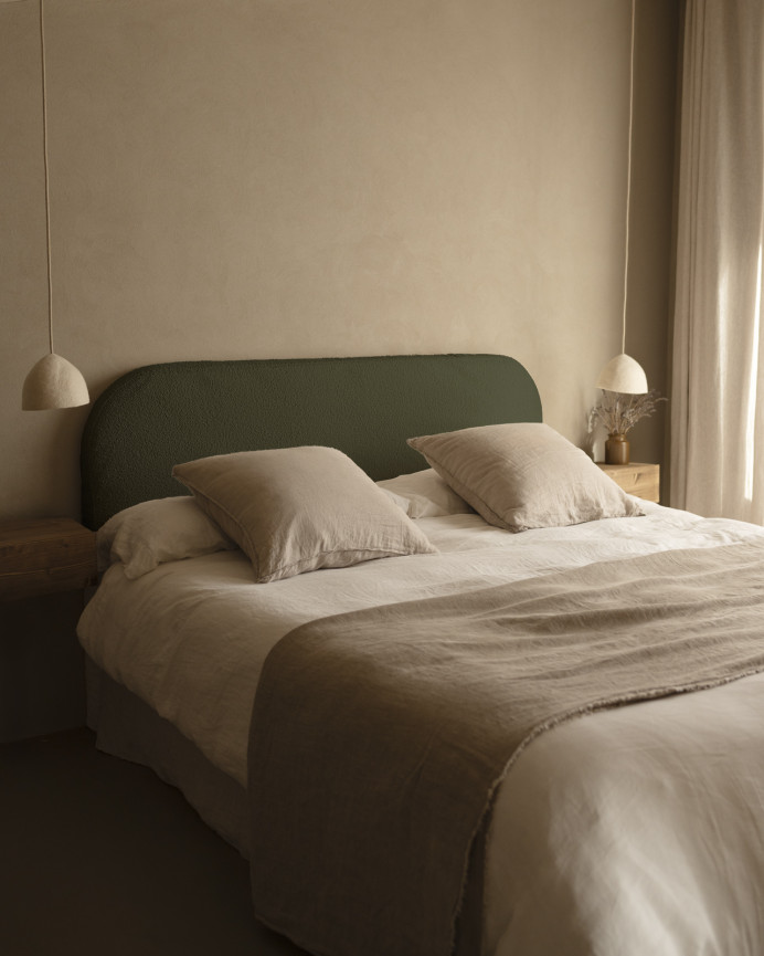 Upholstered headboard with removable cover in green bouclé fabric in various sizes.