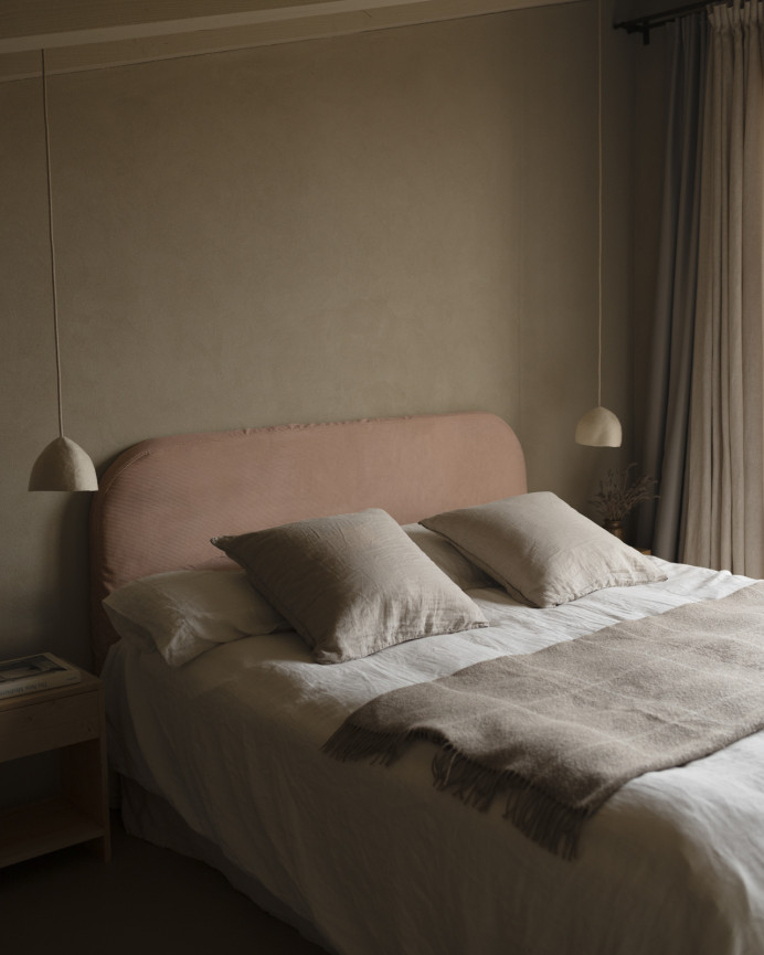 Upholstered headboard with removable coral corduroy cover, available in various sizes.