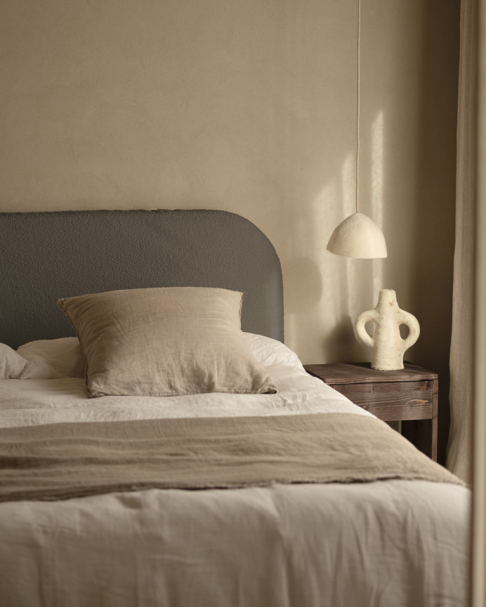 Removable dark gray bouclé upholstered headboard available in various sizes.