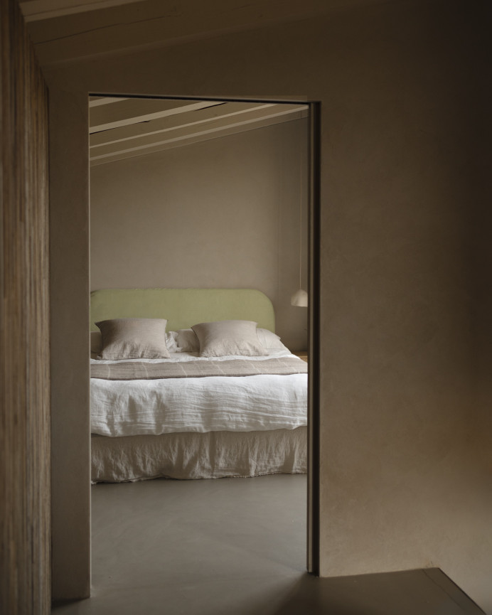 Upholstered headboard with removable lime corduroy cover in various sizes.