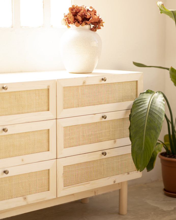 Solid wood and raffia dresser with six drawers in a natural tone measuring 76x120cm.
