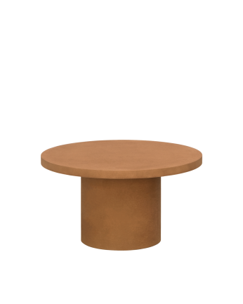 Round microcement coffee table in terracotta tone available in various sizes.