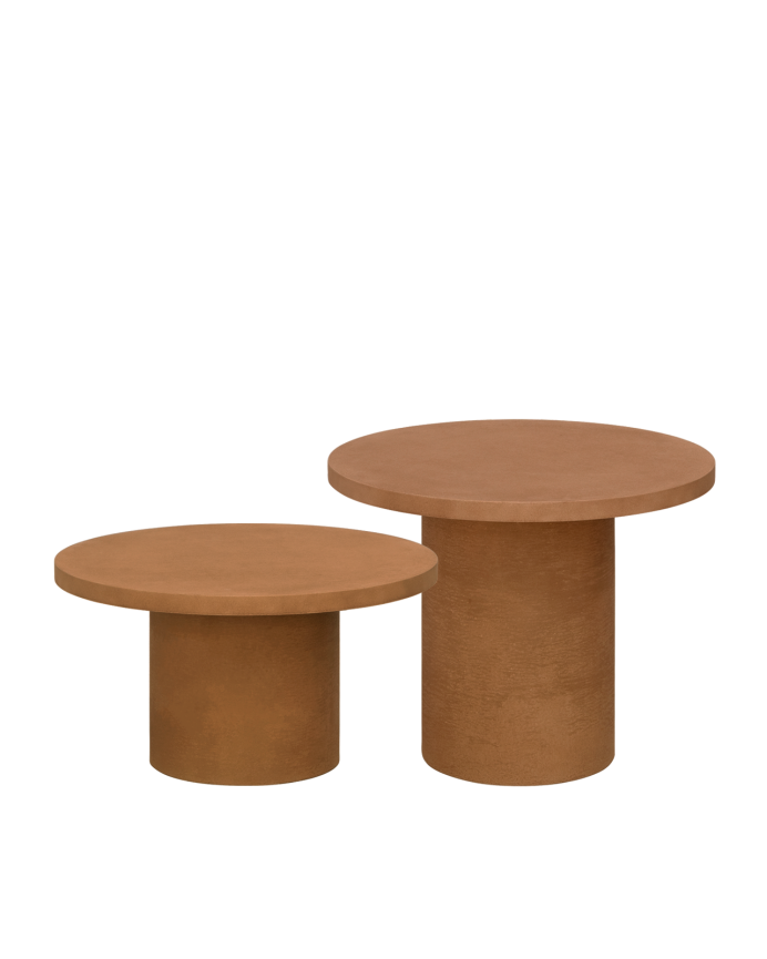 Round microcement coffee table in terracotta tone available in various sizes.