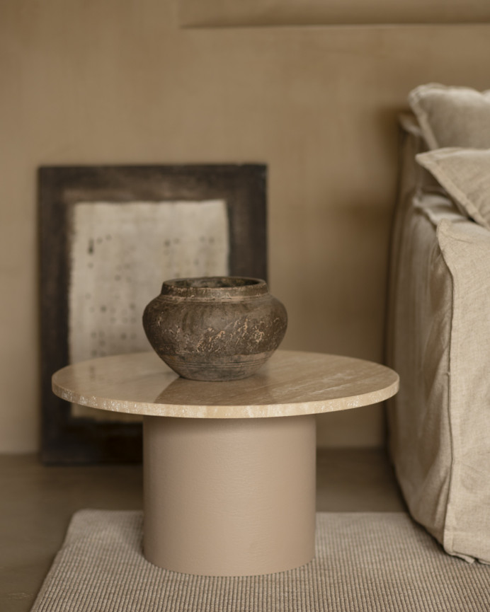 Round travertine marble coffee table with beige microcement legs available in various sizes.