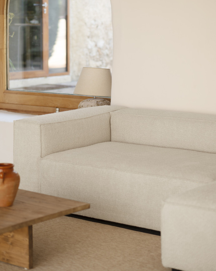 Bouclé sofa with light gray chaise longue in various sizes.