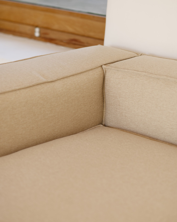 Beige sofa with chaise lounge in various sizes.