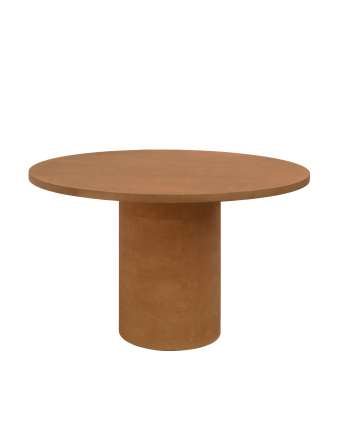 Round dining table made of terracotta-tone microcement in various sizes.
