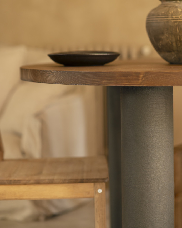 Round solid oak wood dining table with dark oak tone and microcement legs in various sizes.