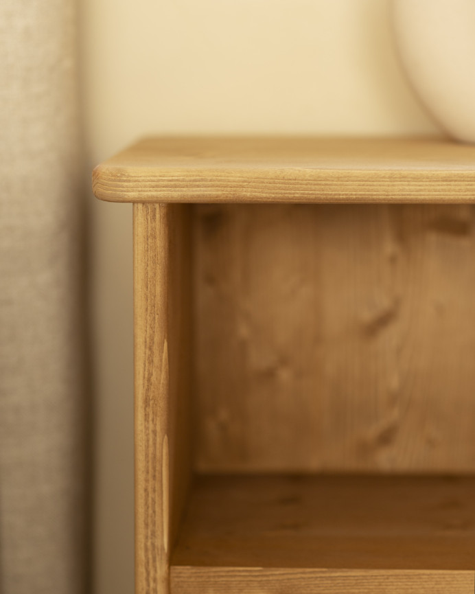 Solid wood bedside table in a medium oak tone measuring 50x42cm.