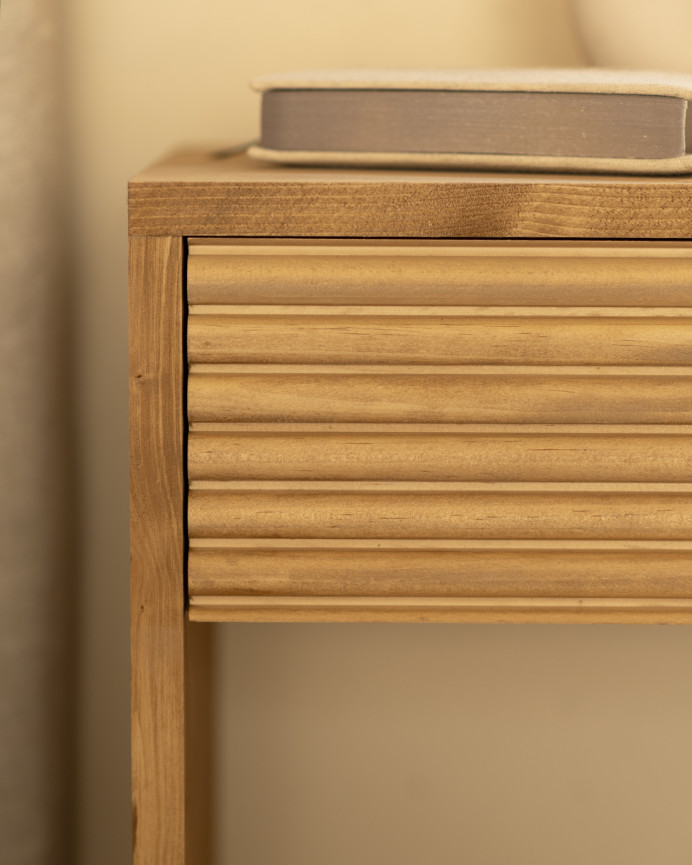 Solid wood bedside table with a drawer in a medium oak tone of various sizes.