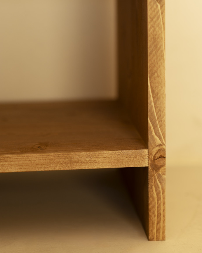 Solid wood bedside table with a drawer in a medium oak tone of various sizes.