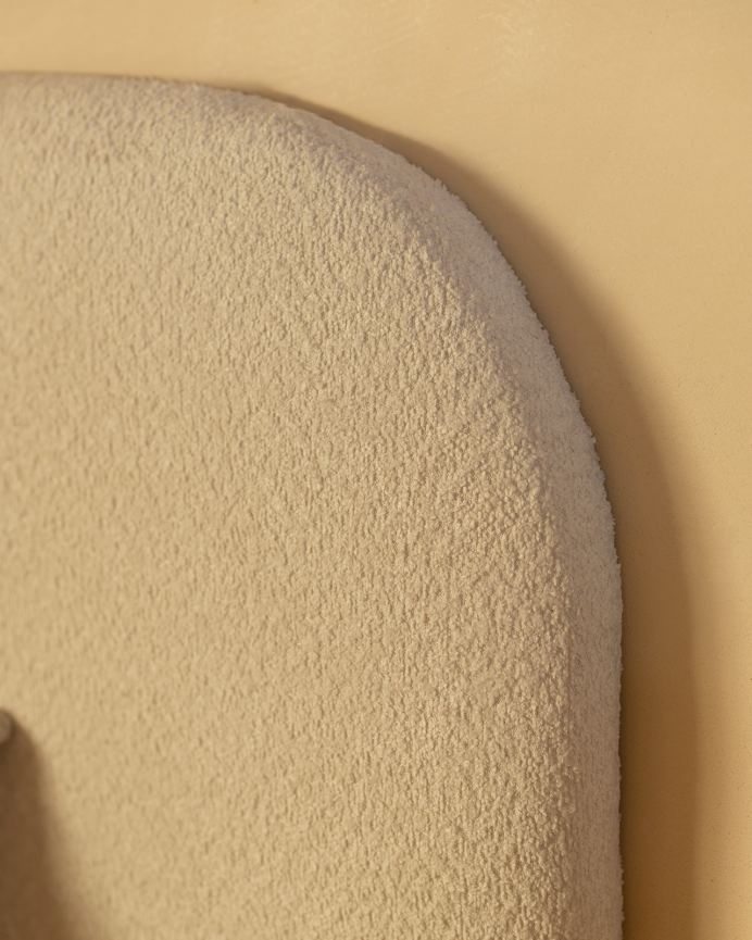 Upholstered light gray bouclé base for mattress of various sizes.