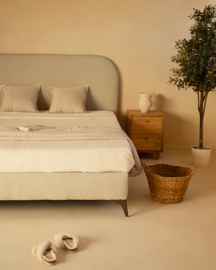 Upholstered light gray bouclé base for mattress of various sizes.
