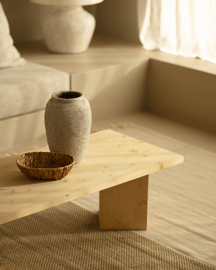 Solid wood coffee table in a medium oak tone measuring 120x55cm.