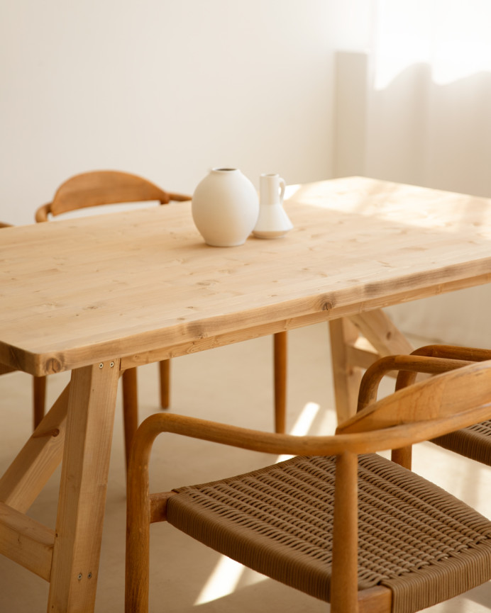 Solid wood dining table in a medium oak tone available in various sizes.