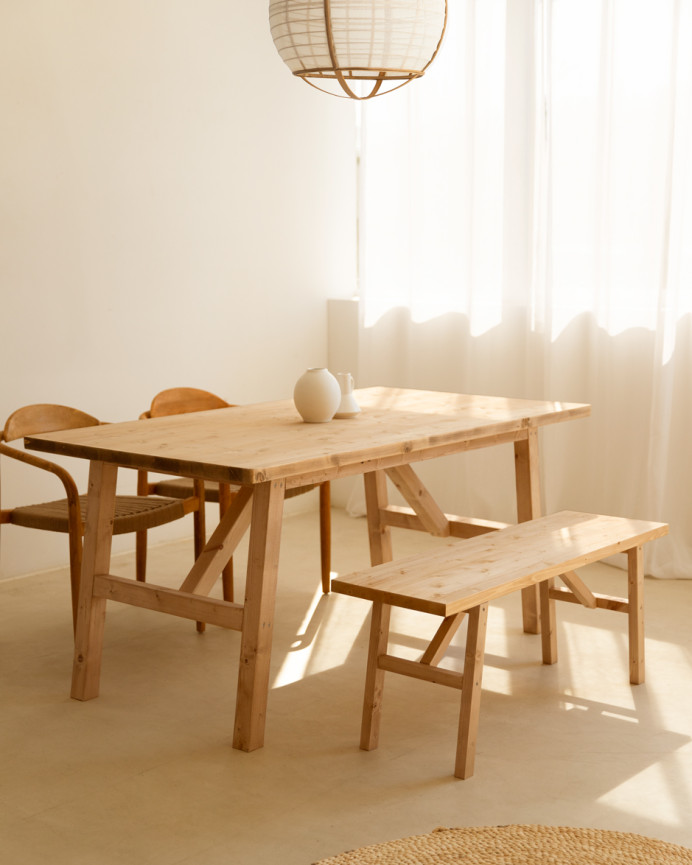 Solid wood dining table in a medium oak tone available in various sizes.