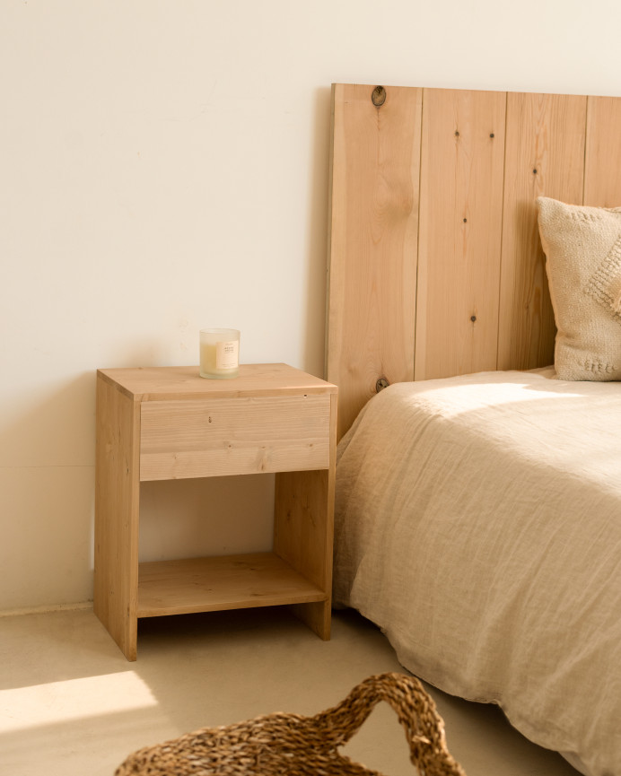 Set of 2 solid wood side tables with a drawer in a medium oak tone in various sizes.