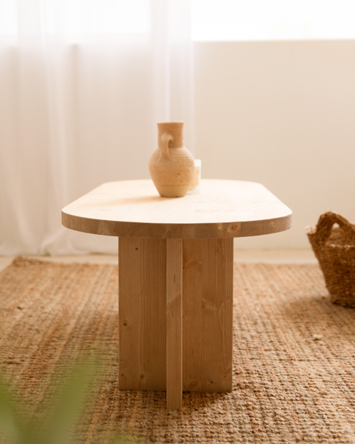 Solid wood coffee table in medium oak tone measuring 120x50cm.