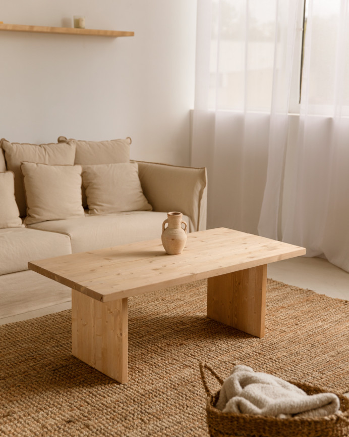Solid wood coffee table in medium oak tone measuring 47x60cm.