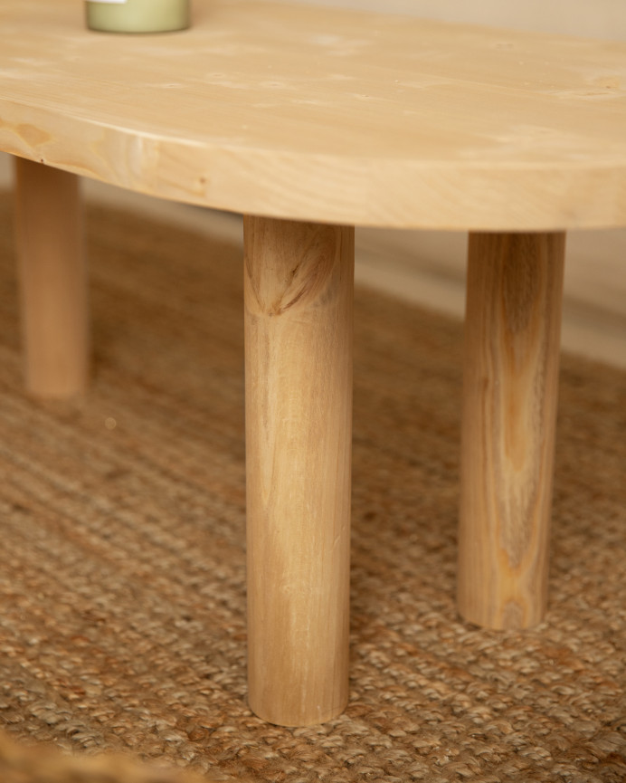 Solid wood oval coffee table in medium oak tone measuring 40x120cm.