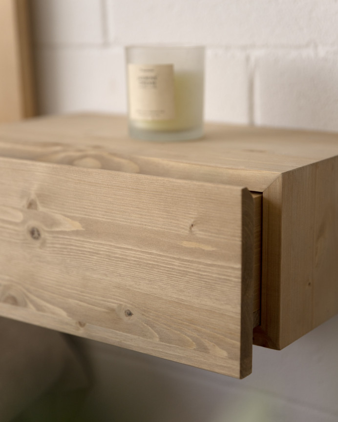 Solid floating oak bedside table in a medium oak tone measuring 40cm