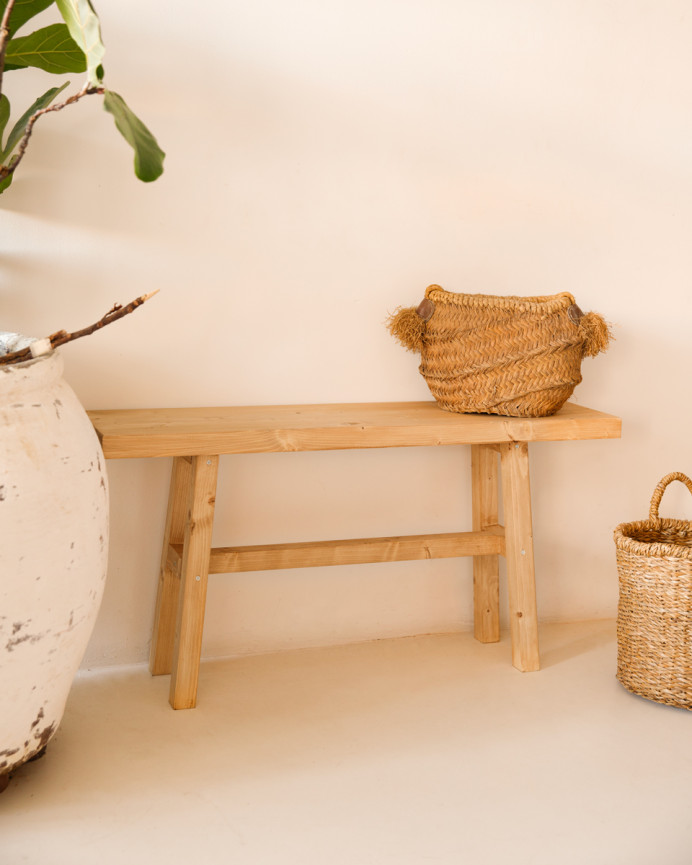 Solid wood stool in a medium oak tone, measuring 100x50cm.