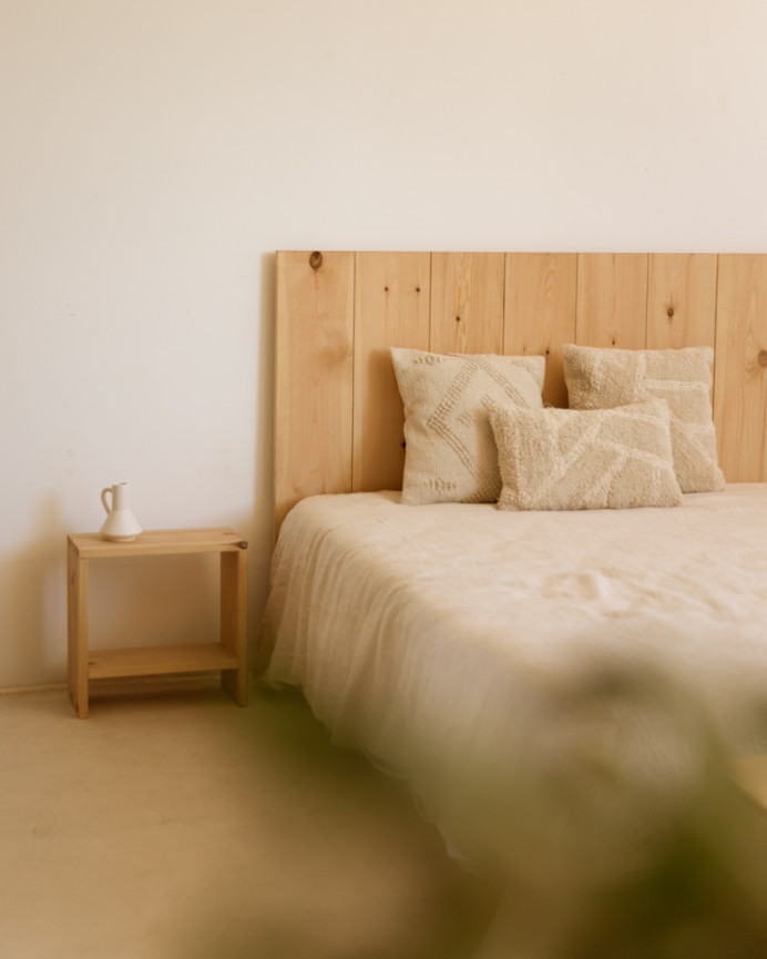 Solid wood bedside table in a medium oak tone measuring 40x20cm.