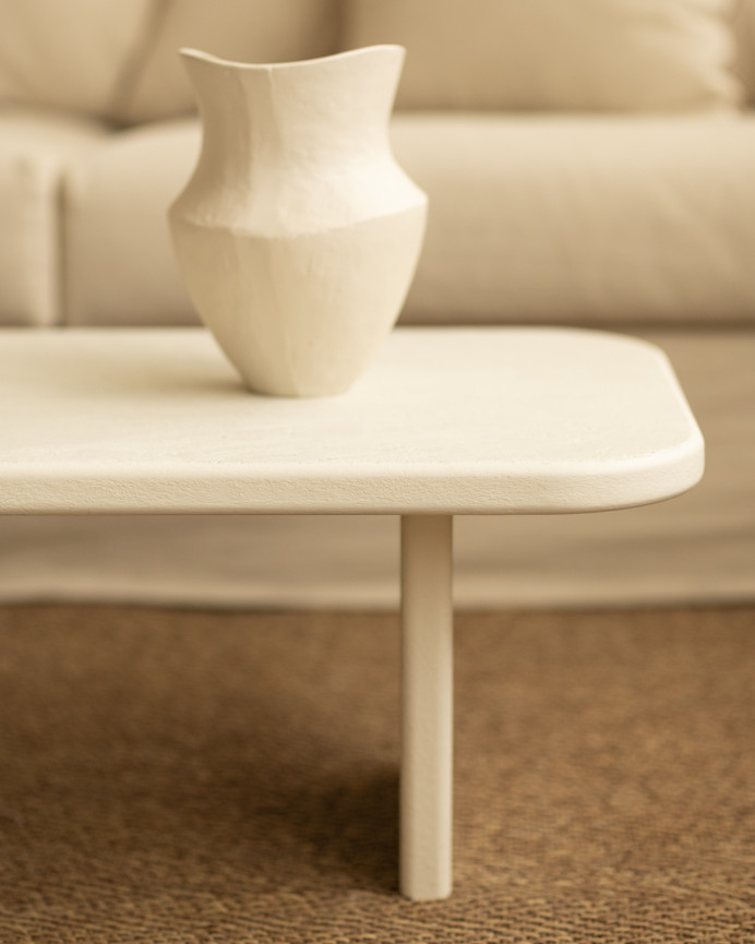 Micro-cement coffee table with two legs in a light off-white tone, 95cm.