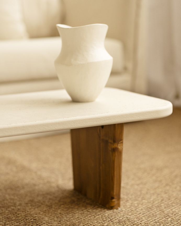 Concrete coffee table with two dark oak wood legs, 95cm wide.