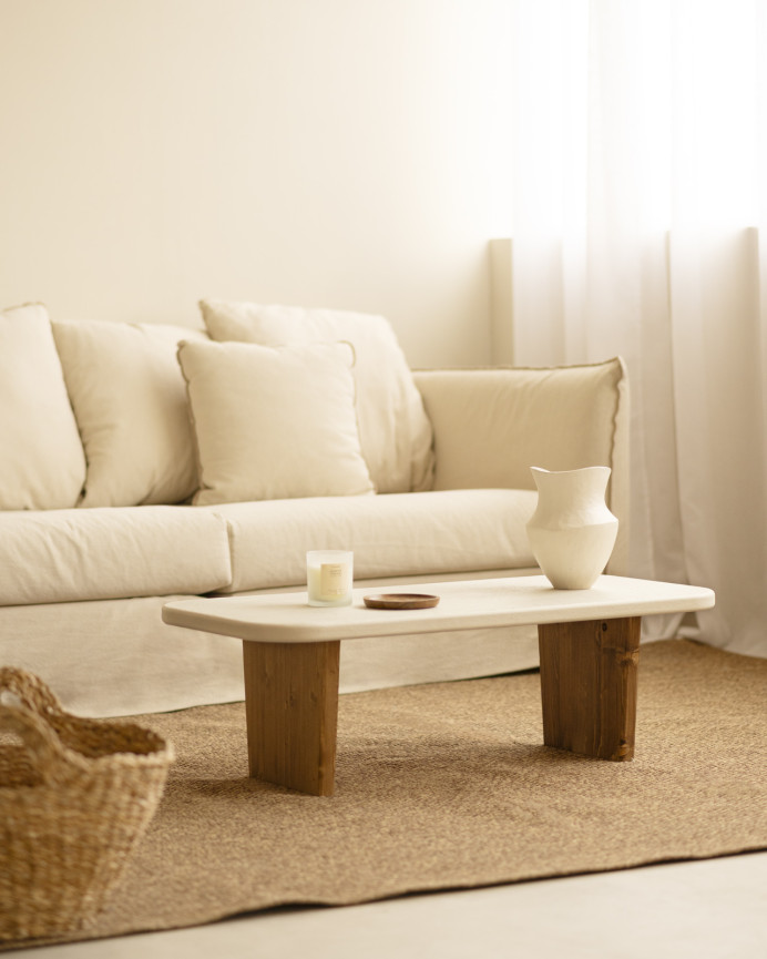 Concrete coffee table with two dark oak wood legs, 95cm wide.