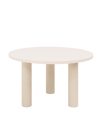Round dining table made of microcement in off-white tone, available in various sizes.