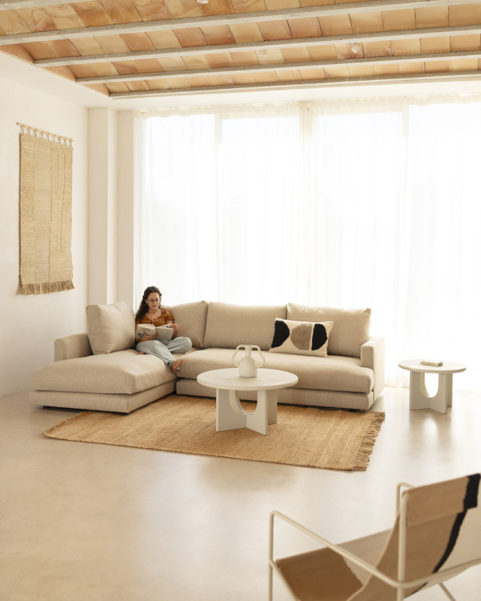 Beige sofa with chaise longue of different sizes.