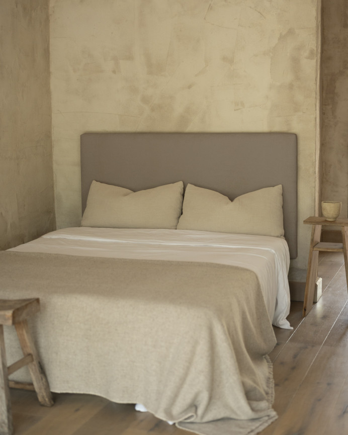 Upholstered headboard in brown color available in various sizes.