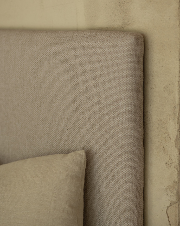 Upholstered headboard in light brown color available in various sizes.