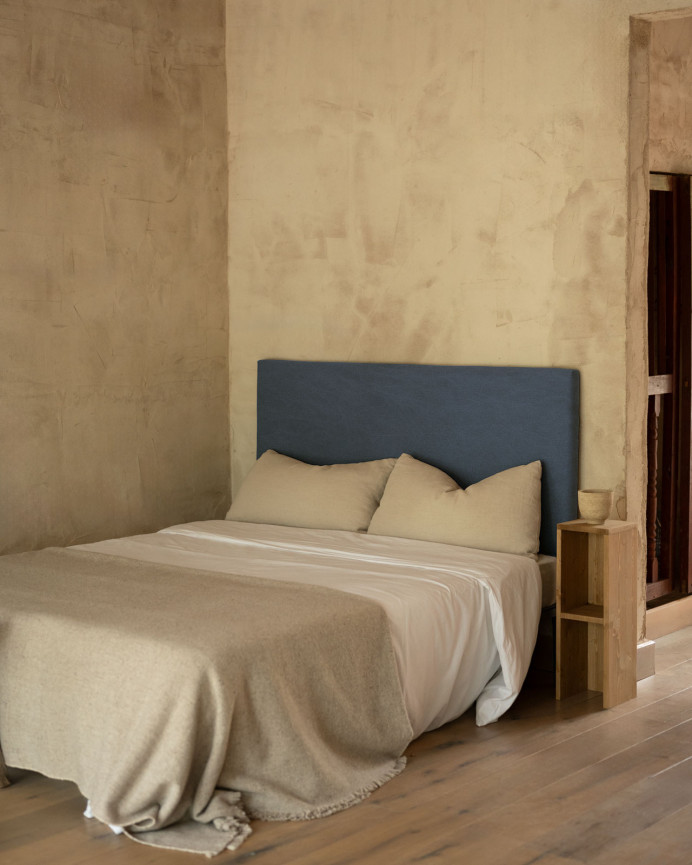 Upholstered headboard in blue color available in various sizes.