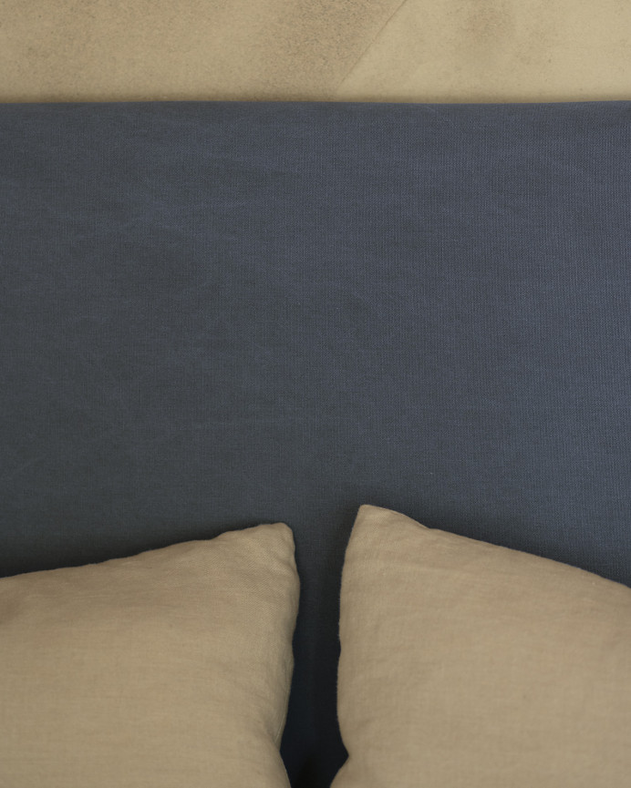 Upholstered headboard in blue color available in various sizes.