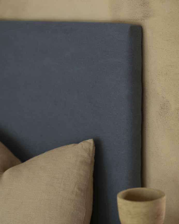 Upholstered headboard in blue color available in various sizes.