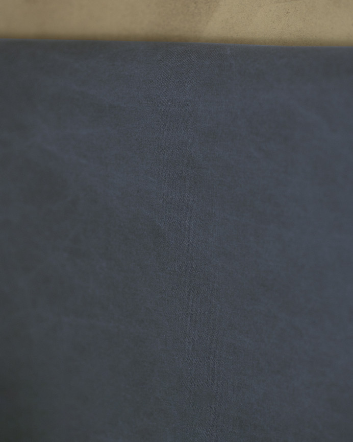 Upholstered headboard in blue color available in various sizes.