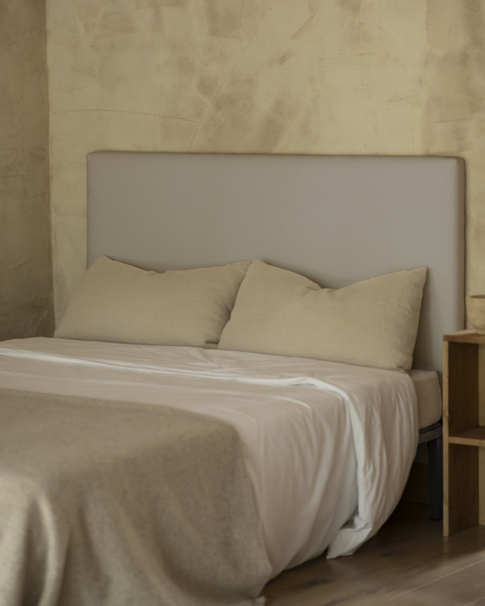 Upholstered headboard in light gray color available in various sizes.
