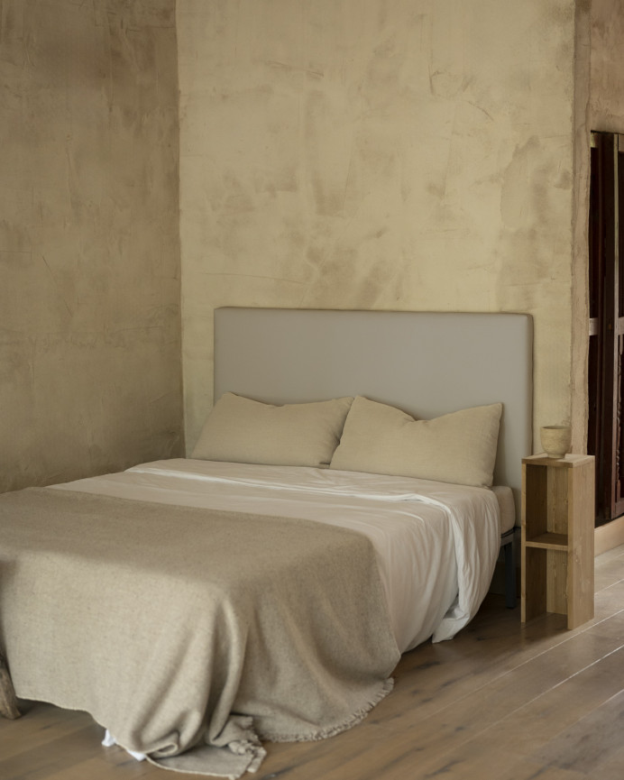Upholstered headboard in light gray color available in various sizes.