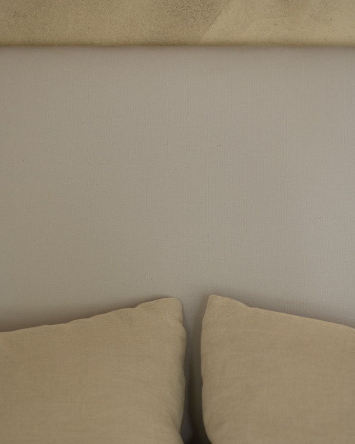 Upholstered headboard in light gray color available in various sizes.