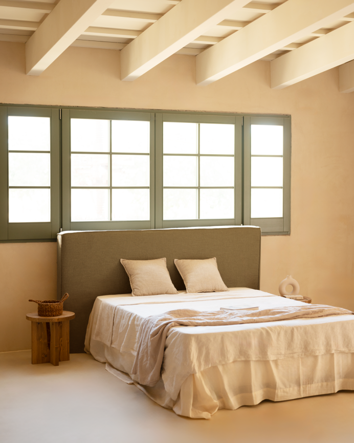 Upholstered headboard in removable green linen in various sizes.